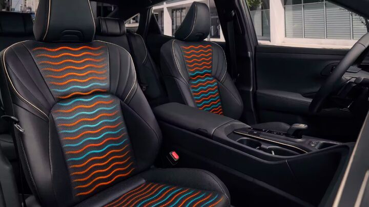 Interior of vehicle showing leather heated and cooling seats radiating