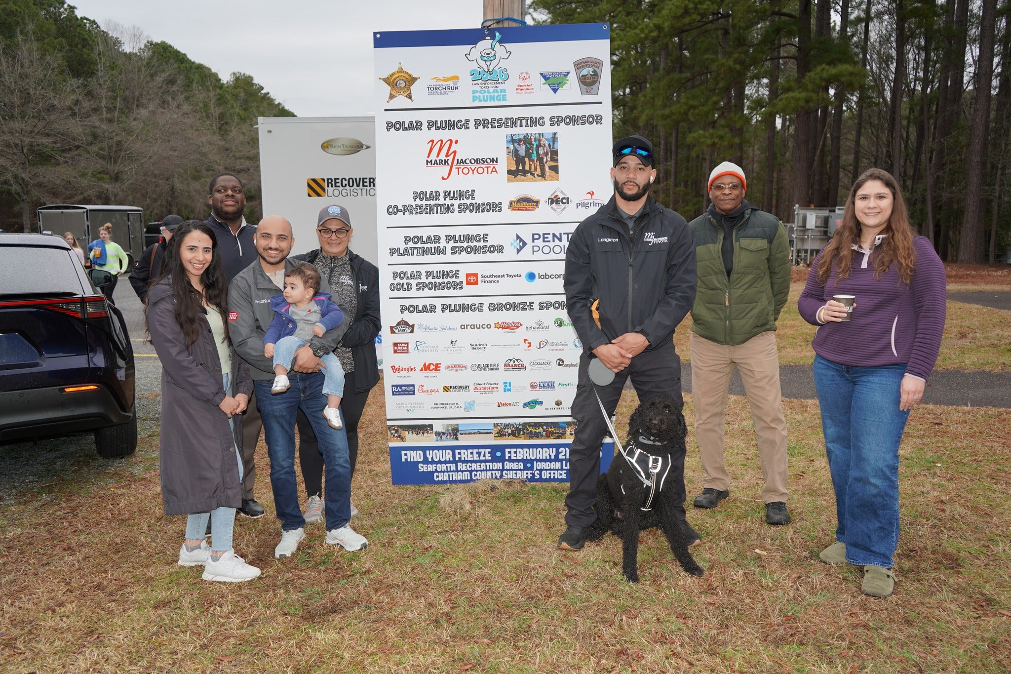 Participants running into the water at Polar Plunge event