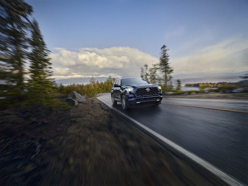 Blue Toyota SUV on Street