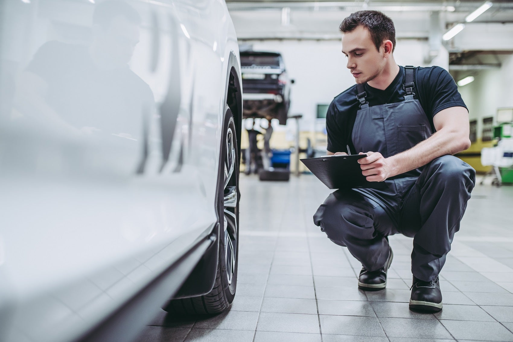 Technician Inspecting Toyota Corolla