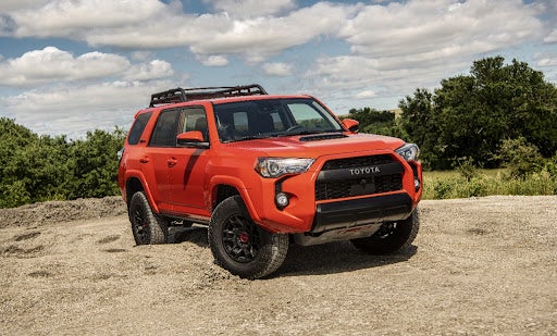 Red Toyota 4Runner on Dirt Terrain