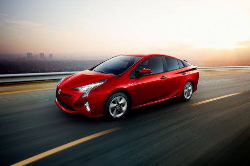 Red Toyota Prius on Street