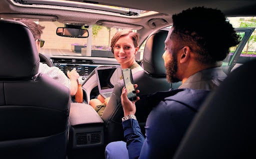 People in Toyota Talking to Eachother